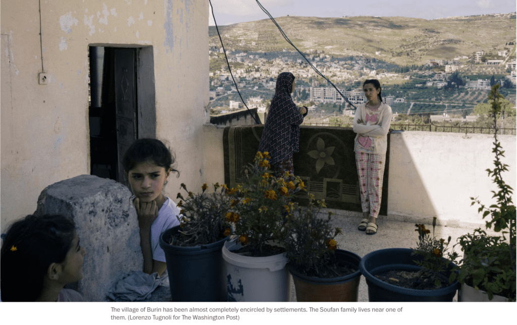 Washington Post — A Palestinian family stands on the balcony of their still-standing brick home in Palestine.